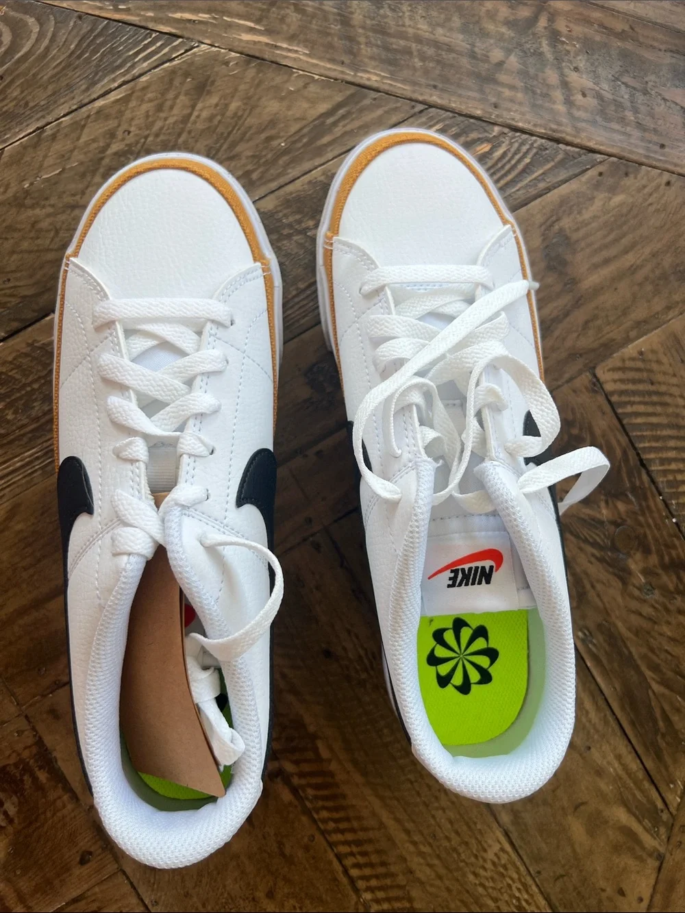 Nike Women’s White Sneakers with Black Swoosh and Tan Trim